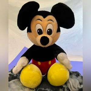 Mickey Mouse plush toy.  Preowned but appears unused.  Clean & great condition!